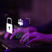 Hands typing on a laptop keyboard with digital security icons, including a padlock and login form, floating above the keys, symbolizing online privacy and data protection. | BeMyNet.com
